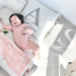 TinyBitz Personalized kids knitted name blanket in light pink and white, perfect as a birthday gifts for kids!