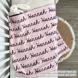 Cotton Kids Blanket with name knitted in light pink and eggplant, made by TinyBitz.