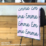 TinyBitz knitted cotton blanket in light purple and teal, personalized with your kid’s name.