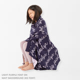 TinyBitz Personalized kids knitted name blanket in navy and light purple, perfect as a birthday gifts for kids!