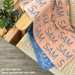 TinyBitz Personalized kids knitted name blanket in peach and sky blue, perfect as a birthday gifts for kids!