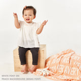TinyBitz Kids Blanket in peach and white, personalized with child's name and made from 100% cotton.