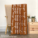 TinyBitz Personalized kids knitted name blanket in rust and white, perfect as a birthday gifts for kids!