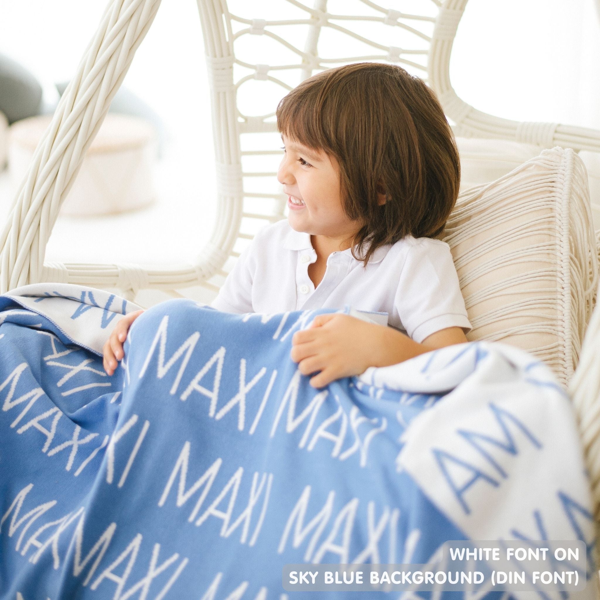 TinyBitz knitted cotton blanket in sky blue and white, personalized with your kid’s name.