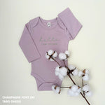 Organic cotton baby onesie with custom name, ideal for birth announcements, baby shower gifts, and keepsakes by TinyBitz.