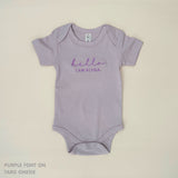 TinyBitz Personalised baby onesie with embroidered name in soft taro cotton, perfect for birth announcements and newborn photos.