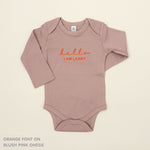 Organic cotton baby onesie with custom name, ideal for birth announcements, baby shower gifts, and keepsakes by TinyBitz.