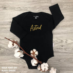 Custom name onesie in black, personalised baby clothing made with soft breathable fabric by TinyBitz.