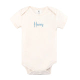 Minimalist personalised onesie in neutral tones with name embroidery, styled for newborn birth announcements by TinyBitz.