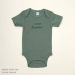 Organic cotton baby onesie with custom name, ideal for birth announcements, baby shower gifts, and keepsakes by TinyBitz.