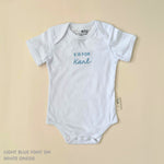 Organic cotton baby onesie with custom name, ideal for birth announcements, baby shower gifts, and keepsakes by TinyBitz.