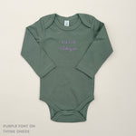 TinyBitz Custom baby onesie in thyme with name embroidery, unique outfit for baby’s birth announcement or first photoshoot.
