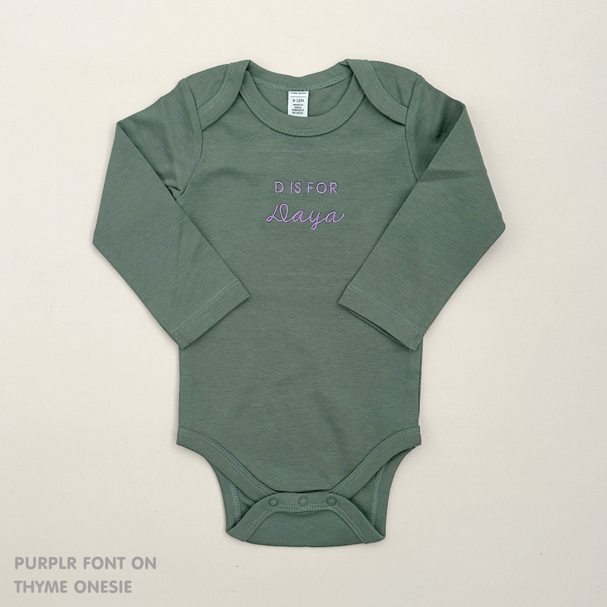 TinyBitz Custom baby onesie in thyme with name embroidery, unique outfit for baby’s birth announcement or first photoshoot.