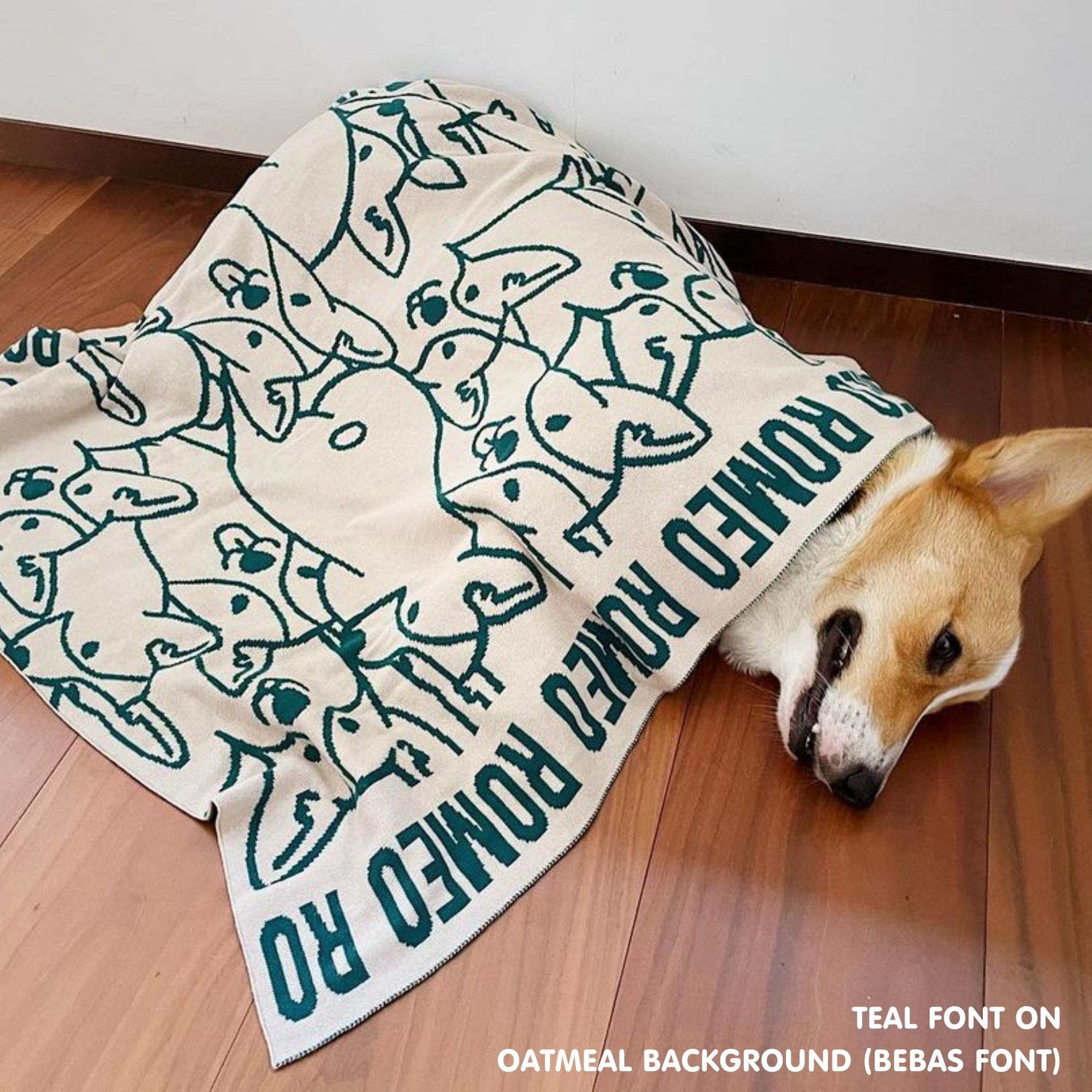 Personalised pet blanket for Corgi in oatmeal and teal knitted cotton, custom dog blanket by TinyBitz, styled on modern wooden dog bed.