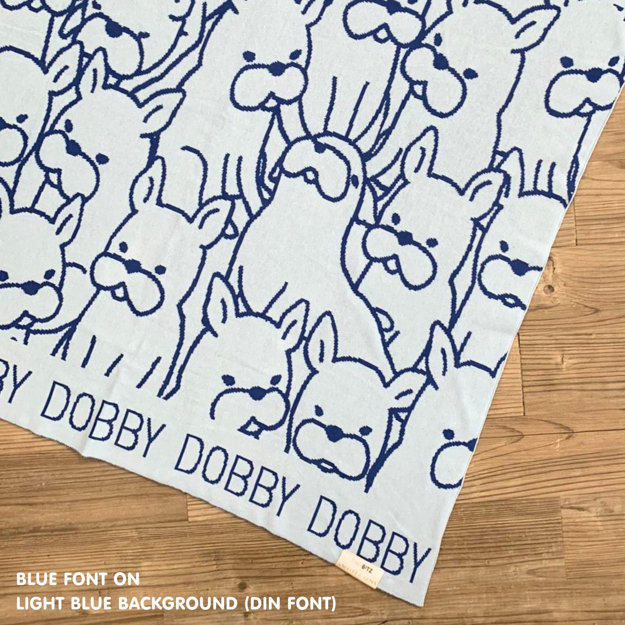 Personalised pet blanket in light blue and blue knitted cotton, cozy custom dog blanket by TinyBitz, perfect personalized gift for pet lovers.