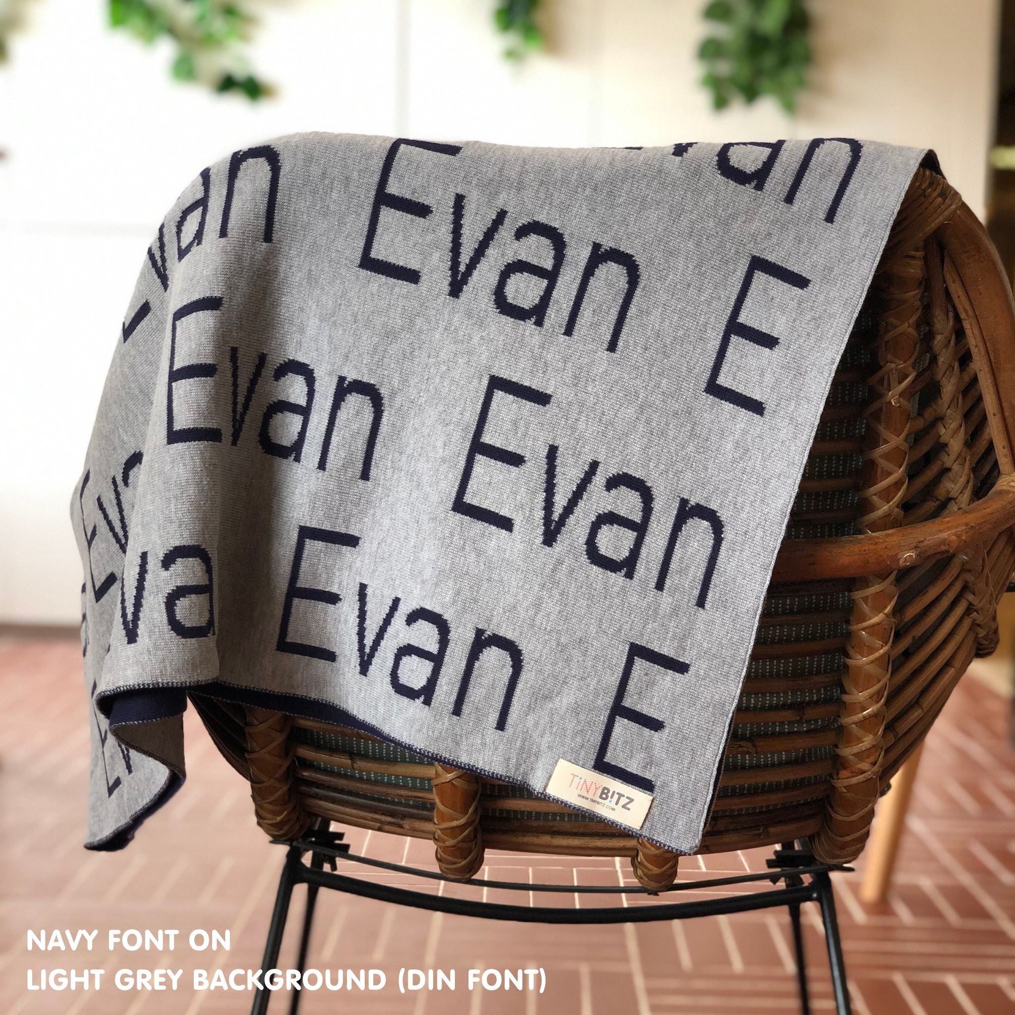 Personalised pet blanket in light grey and navy knitted cotton, custom knitted dog blanket by TinyBitz, perfect gift for dog lovers.