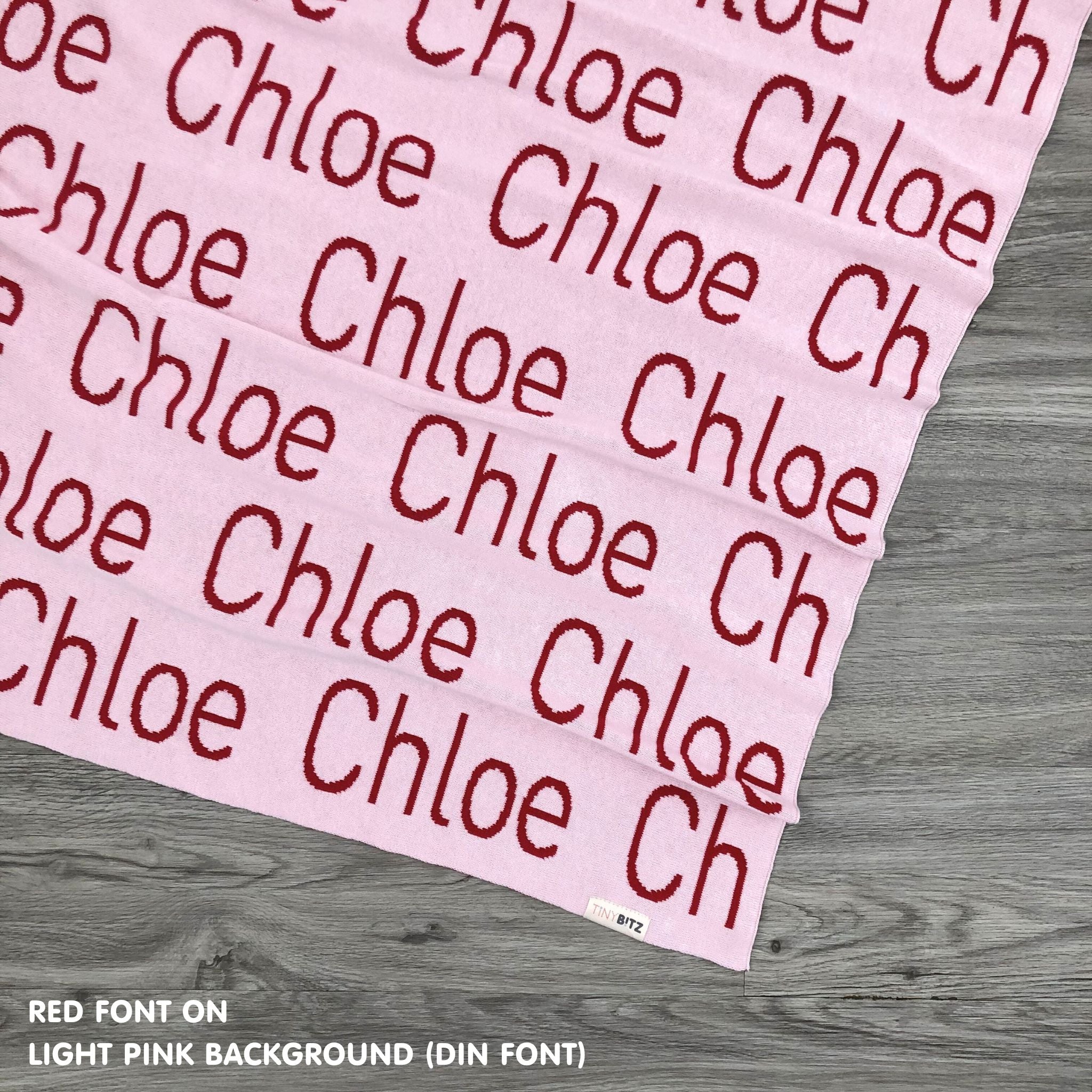 Personalised pet blanket in light pink and red knitted cotton, cozy custom cat blanket by TinyBitz, perfect personalized gift for pet lovers.