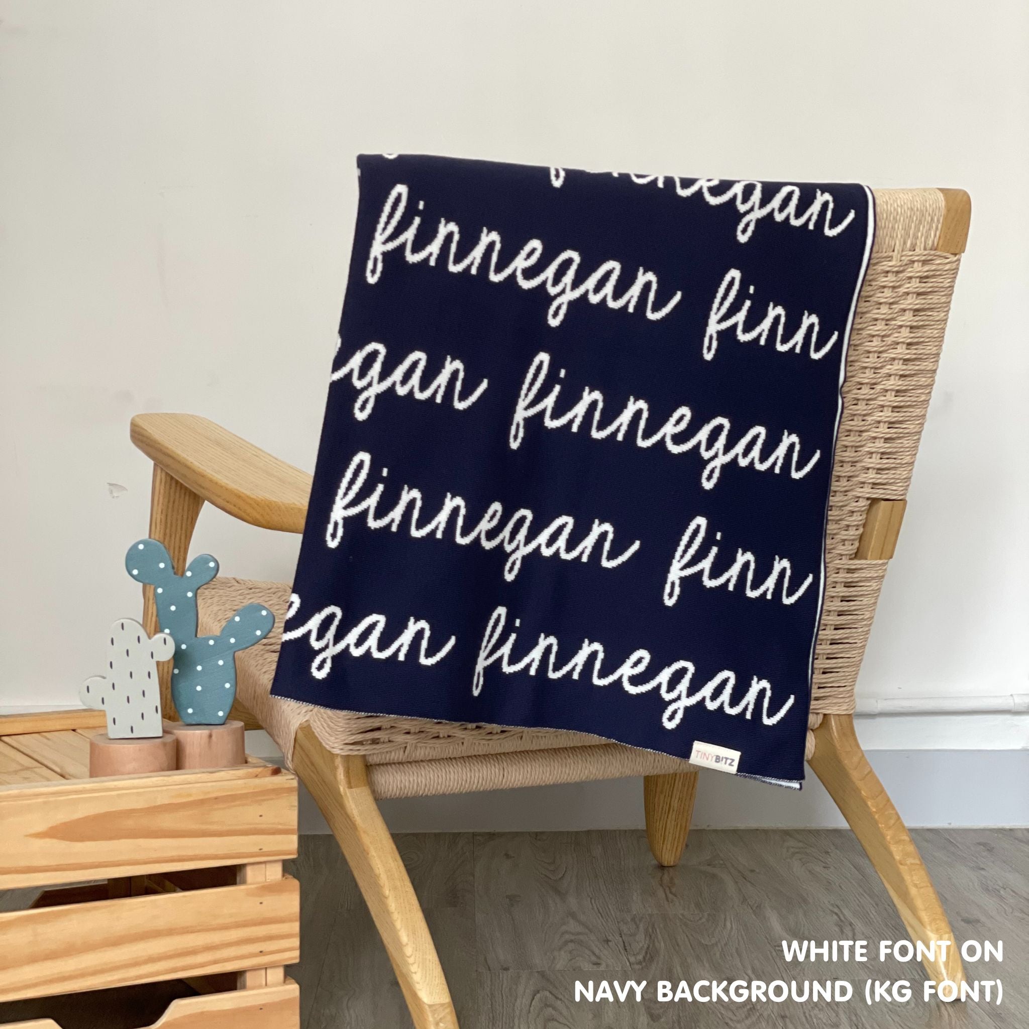 Personalised pet blanket in navy and white knitted cotton, custom knitted dog blanket by TinyBitz, perfect gift for dog lovers.