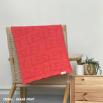 TinyBitz Personalized name blanket in coral background, one colour with monogram, perfect newborn gifts.