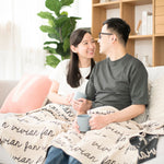 Personalized blanket with couple's name knitted in oatmeal and charcoal made by TinyBitz.