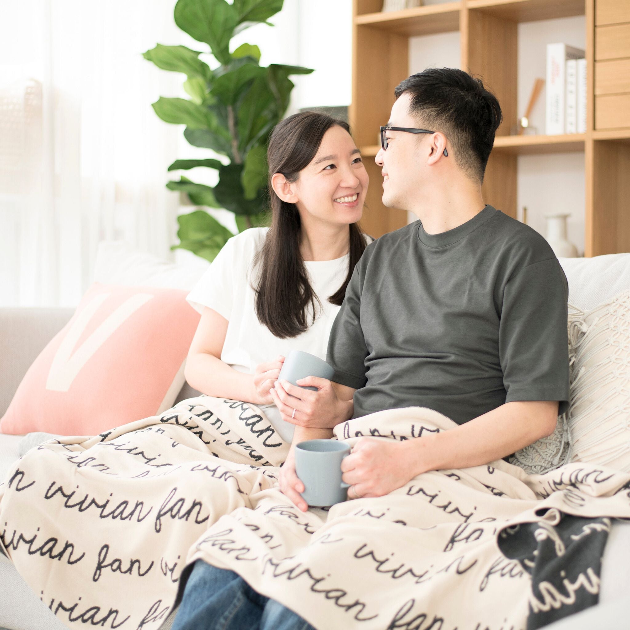 Personalized blanket with couple's name knitted in oatmeal and charcoal made by TinyBitz.