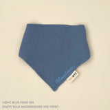 Organic cotton baby bib with name stitched on dusty blue fabric, personalised baby gifts by TinyBitz.