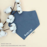 Organic personalised bib for babies in dusty blue, featuring baby name in script font, unique baby gift idea by TinyBitz.