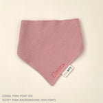 Custom baby bib in dusty pink with embroidered name, personalised baby gift made from breathable muslin by TinyBitz.