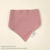 Custom baby bib in dusty pink with embroidered name, personalised baby gift made from breathable muslin by TinyBitz.
