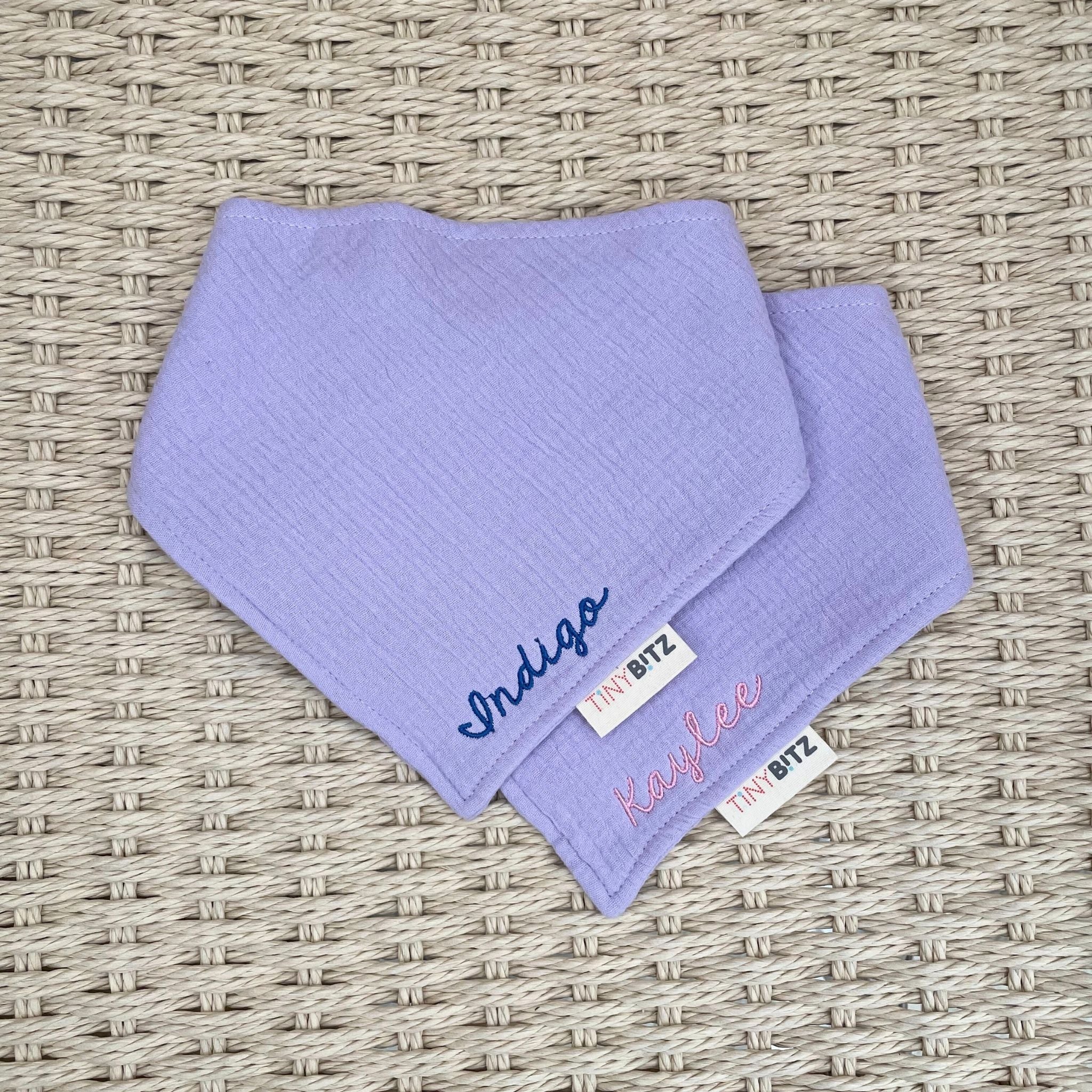 Neutral-toned personalised baby bib with minimalist name embroidery, custom made to order newborn gift by TinyBitz.
