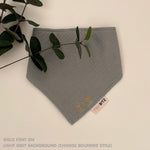 Neutral-toned personalised baby bib with minimalist name embroidery, custom made to order newborn gift by TinyBitz.