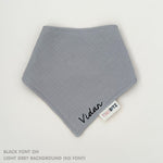 Organic personalised bib for babies in light grey, featuring baby name in script font, unique baby gift idea by TinyBitz.