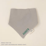Organic cotton baby bib with name stitched on light grey fabric, personalised baby gifts by TinyBitz.
