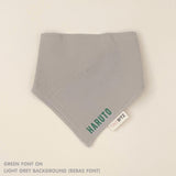 Organic cotton baby bib with name stitched on light grey fabric, personalised baby gifts by TinyBitz.