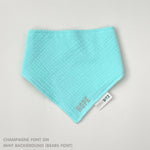Custom baby bib in mint with embroidered name, personalised baby gift made from breathable muslin by TinyBitz.