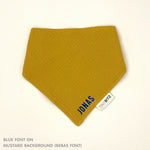 Organic personalised bib for babies in mustard, featuring baby name in script font, unique baby gift idea by TinyBitz.
