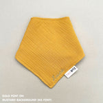 Custom baby bib in mustard with embroidered name, personalised baby gift made from breathable muslin by TinyBitz.