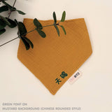 Personalised baby bib in mustard with name embroidery, custom organic cotton bib by TinyBitz, thoughtful baby shower gift.