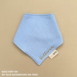 Neutral-toned personalised baby bib with minimalist name embroidery, custom made to order newborn gift by TinyBitz.