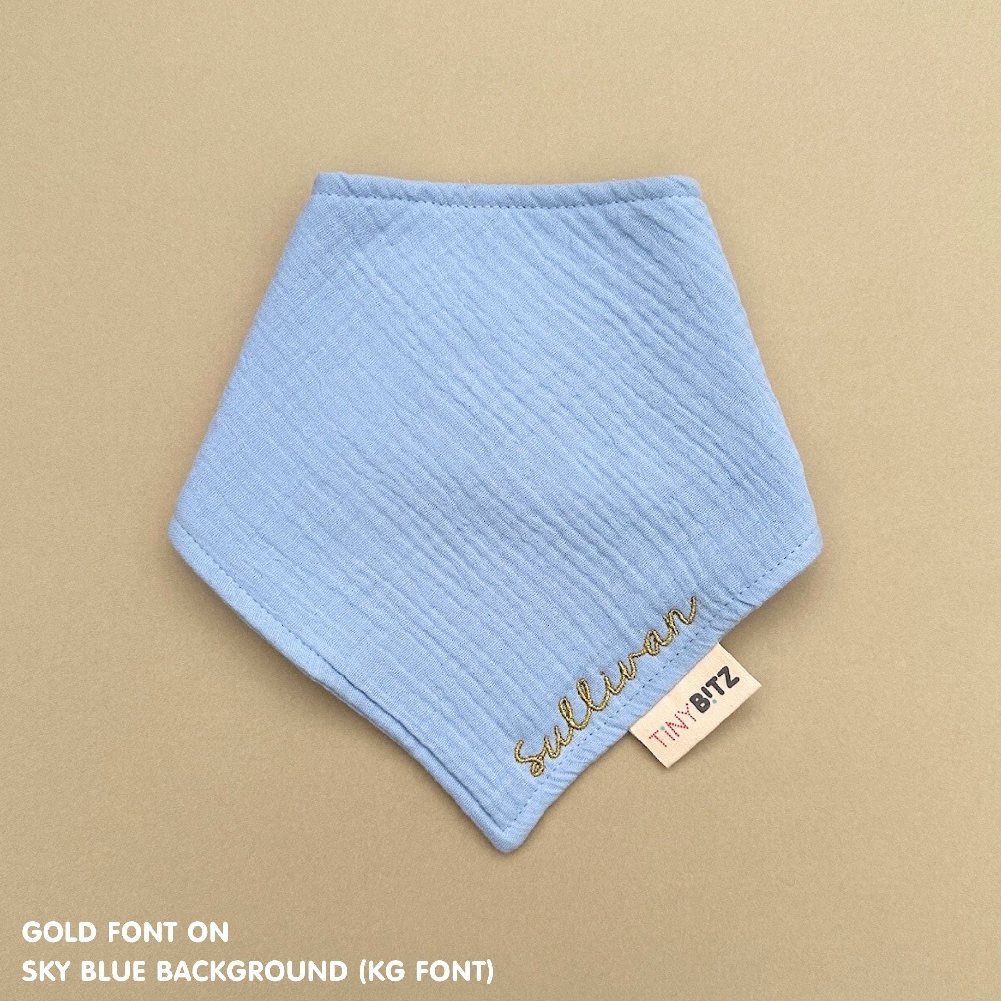 Neutral-toned personalised baby bib with minimalist name embroidery, custom made to order newborn gift by TinyBitz.