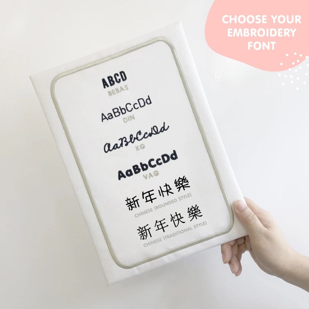 Font options for name personalization on TinyBitz personalized blush pink organic muslin baby bib.