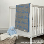 Cotton baby blanket with baby's name knitted in light grey and sky blue, made by TinyBitz.