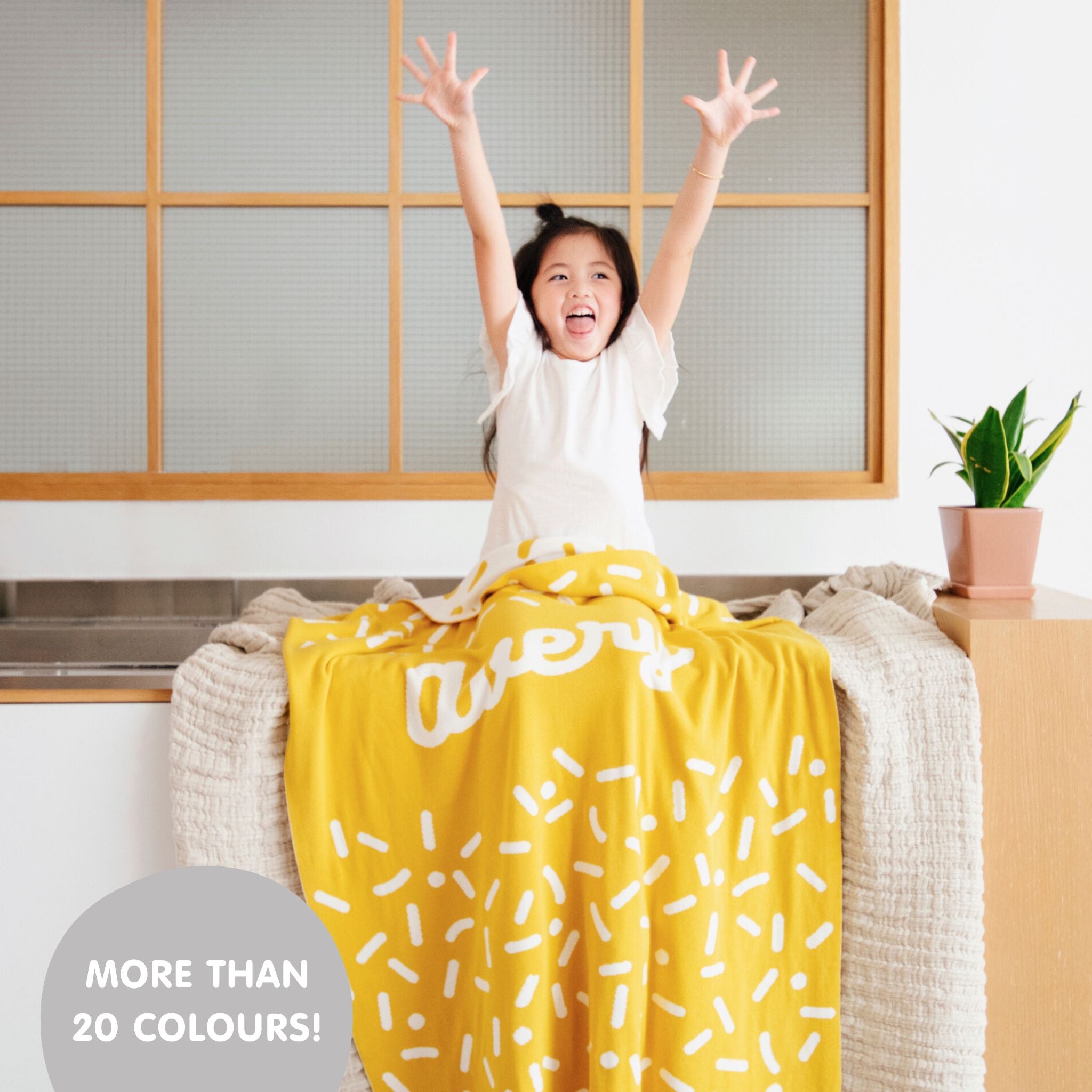 TinyBitz personalized name blanket in mustard and white with a confetti pattern, perfect gift for newborn babies and kids.