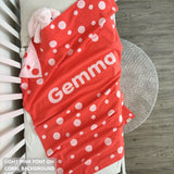 TinyBitz personalized baby name blanket, knitted in coral and light pink with a dot pattern, perfect baby shower gift!