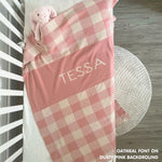 Cotton baby blanket with baby's name, knitted in dusty pink and oatmeal with a check pattern, made by TinyBitz.