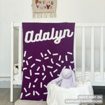 TinyBitz personalized name blanket in eggplant and white with a confetti pattern, perfect gift for newborn babies and kids.