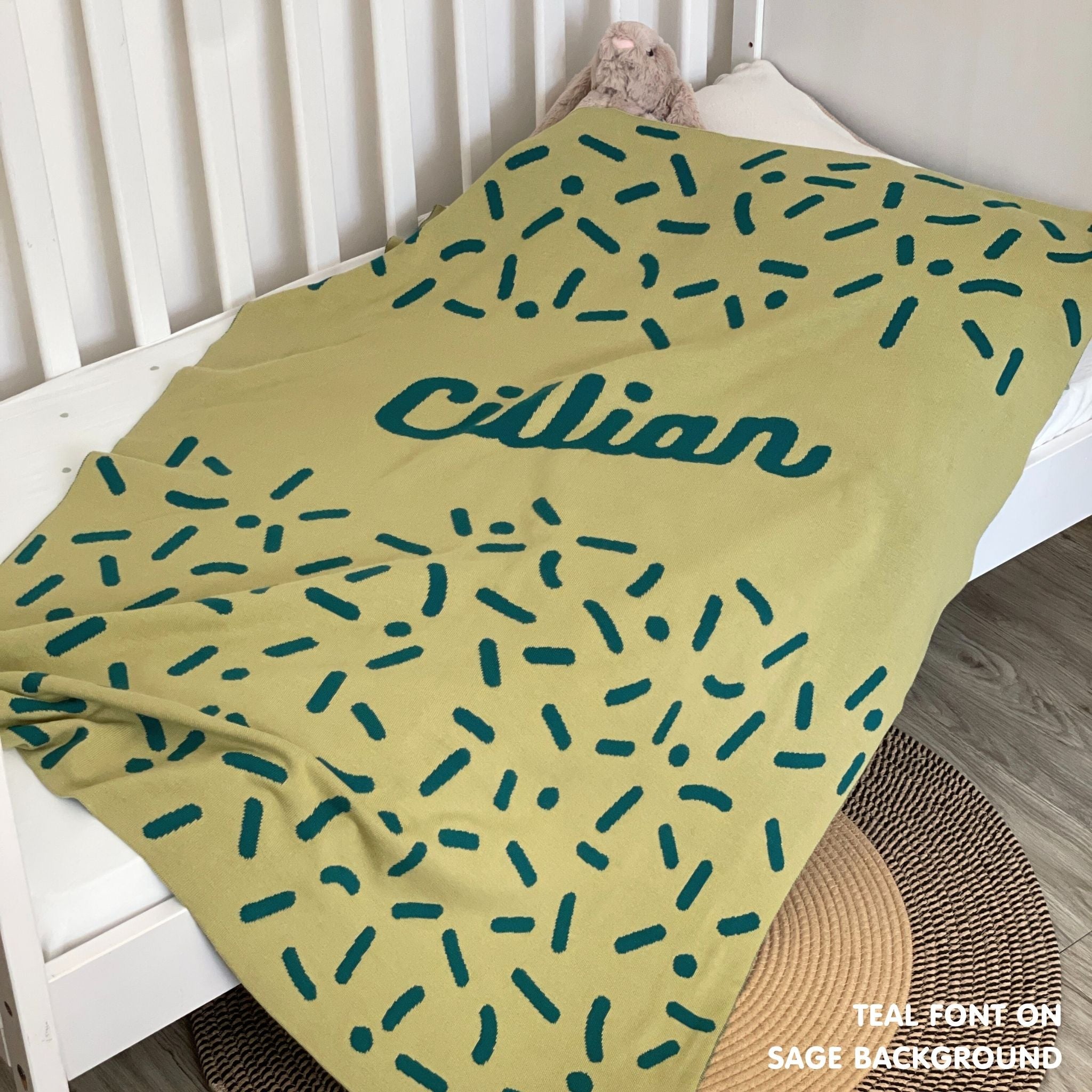 TinyBitz personalized baby name blanket, knitted in sage and teal with a confetti pattern, perfect baby shower gift!
