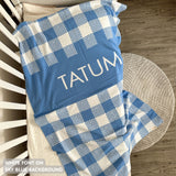 Knitted baby blanket in sky blue and white with a check pattern, customised with baby's name, made by TinyBitz.
