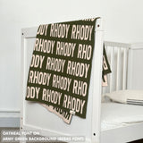 Cotton baby blanket with baby's name knitted in army green and oatmeal, made by TinyBitz.