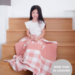 TinyBitz personalized name blanket in dusty pink and white with a dot pattern, perfect gift for newborn babies.